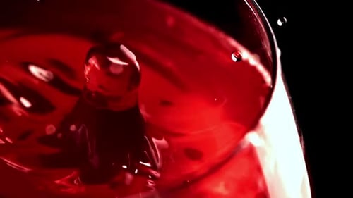 Drop of Red Liquid Splashing in Slow Motion