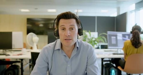 Businessman with Headset on a Video call in an Office, Telemarketing, Call centre