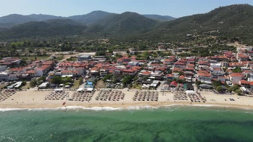 Sarti, Sithonia, Greece. Aerial View of Beach and Cityscape on Sunny Summer Day, Drone Shot