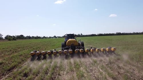 Blue Tractor O.A. Planting Canola On No Till Field