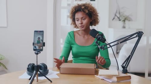 Young Woman Unboxing Product for Vlog Recording