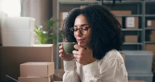Happy Woman with Curly Hair Sips Coffee