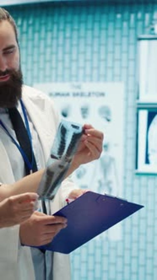 Medical Professionals Discussing X-Ray Results in Hospital