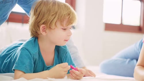 Close up of family spend leisure time with baby boy in bedroom at house.
