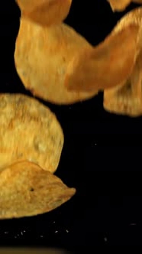 Potato Chips Fall on the Table Filmed on a Highspeed Camera at 1000 Fps