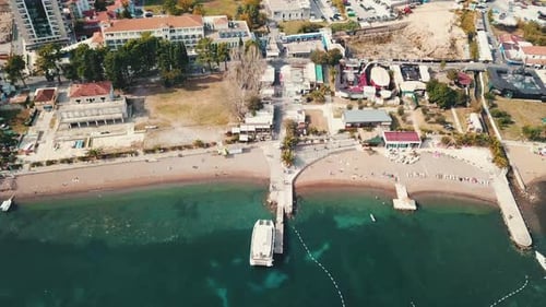Flying over Budva beach near adriatic sea. Aerial drone footage