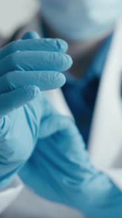 Healthcare Professionals in Medical Settings Wear Protective Gear and Lab Coats to Prioritize
