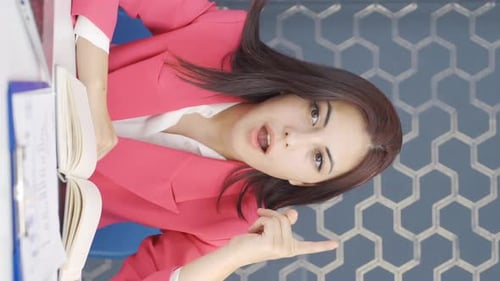 Young Businesswoman Talking in Modern Office Environment