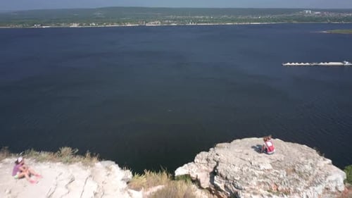 Hikers on the rock. Group of hikers stand on top of the rock ( Camel Rock) and enjoy the view. Zhigu