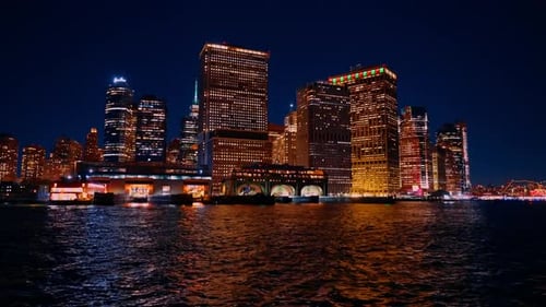 Ferry boat terminal in Staten Island, New York, USA. View on the luminous skyline of the city