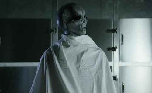 Area 51 Alien Autopsy - Visitor sitting in a morgue