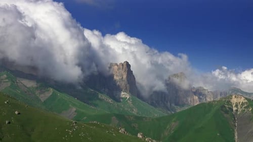 Majestic Mountains Under Cloudy Blue Sky