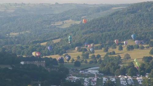 Aerial View of Colorful Hot Air Balloons Rising