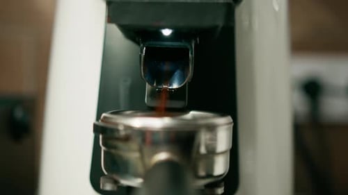 Ground Coffee Beans Fill Portafilter from Grinder