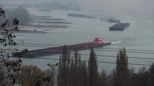 Fluvial transportation: Barges transporting goods on the Rhein river in Germany