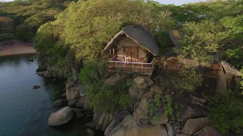 Scenic Island Resort: Woman Enjoying Tropical Getaway From Above