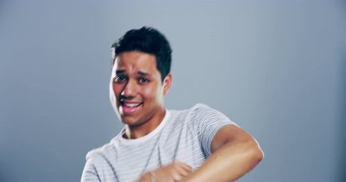 Expressive Young Adult Dancing Happily in Studio