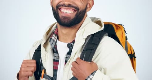 Hiking, backpack and smile of man in studio excited to explore on adventure, journey and holiday