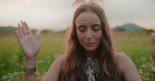 Portrait Of A Woman Meditating Against The Background Of Nature And A Mountain View