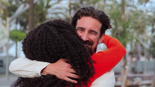 Happy Couple Embracing in Urban Park on Sunny Day