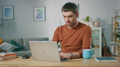 Man working on a laptop at home