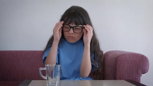 Child Wearing Glasses is Unhappy and Grimacing