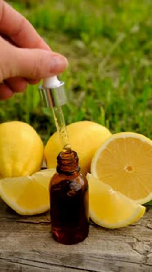 Extracting Oil from Bottle with Lemon Slices