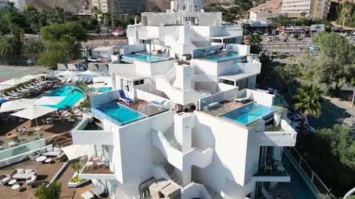 A panoramic view of a coastal hotel captured by a drone