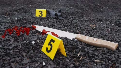 Bloody Knife Crime Scene Evidence With Markers