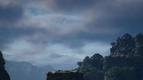 Serene Mountain Landscape With Dramatic Cloudy Sky Backdrop