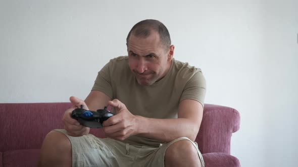 A Man with a Game Console, People Stock Footage ft. gamepad & console ...