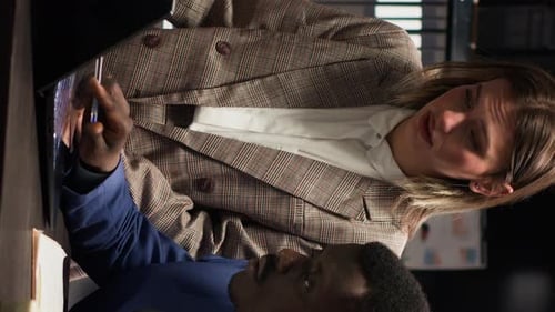 Man and Woman Working Together in Office