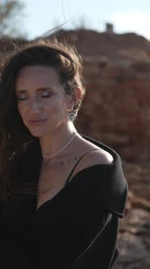 Woman Desert Portrait Photography A Woman with Long Dark Hair is Photographed in the Desert