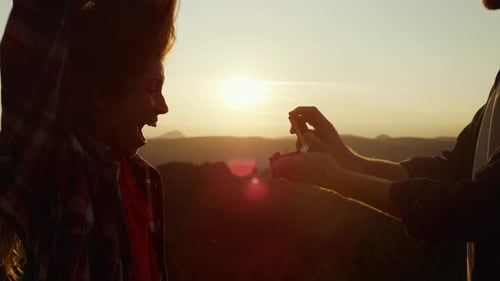 Couple Engaged at Sunset in the Mountains