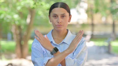 Rejecting Gesture by Tense Mixed Race Woman