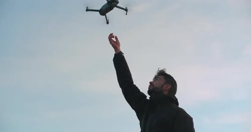 Man Catch Drone in His Hand
