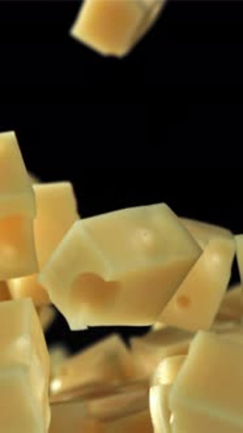 Super Slow Motion Pieces of Cheese on Black Background Filmed on a Highspeed Camera at 1000 Fps