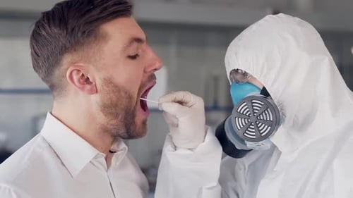 doctor in protective suit takes test for suspected coronavirus