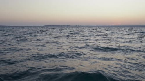 Drone Flies at Low Altitude Over Sea