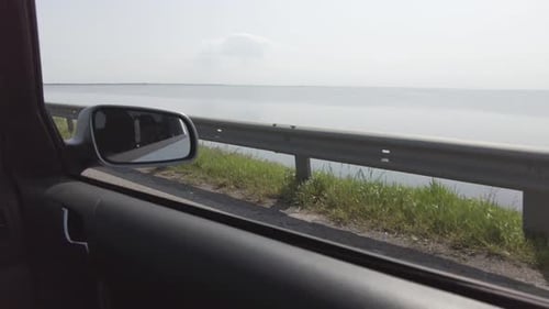 Crossing the river by the bridge inside car POV