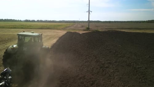 Tractors plowing the field in Ukraine