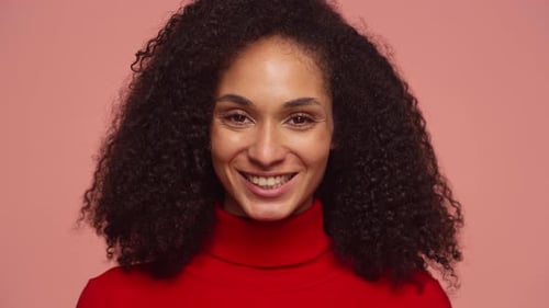 Closeup of Smiling Woman on Pink Background
