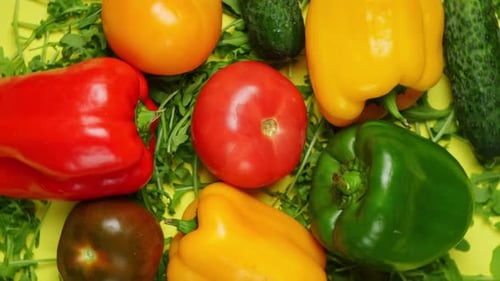 Fresh Vegetables and Greens on Yellow Background
