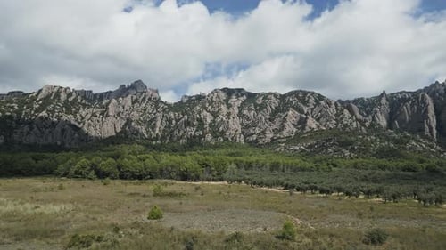 Aerial drone flying towards montserrat mountain in barcelona