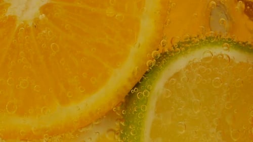 Effervescent Citrus: Orange and Lime in Bubbly Water