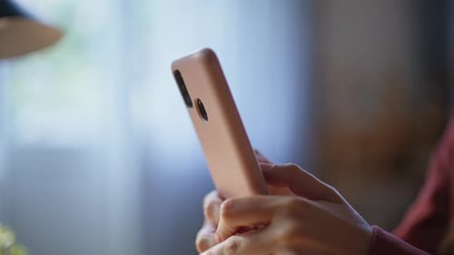 Woman Holds Smart Phone Device Close Up