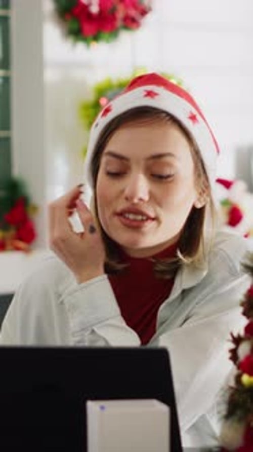 Vertical Video Woman Videocalls Friend in Xmas Office
