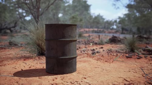 Old Empty Rusted Barrel on Sand