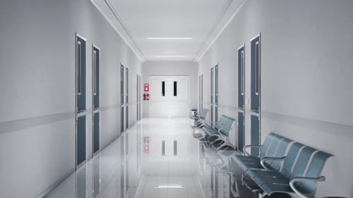 A Clean, Modern Hospital Corridor With Polished Floors And Bright Lighting