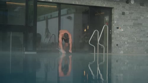 Man Diving Into Swimming Pool